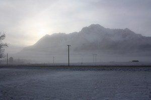 Sun behind Pioneer Peak on a foggy morning